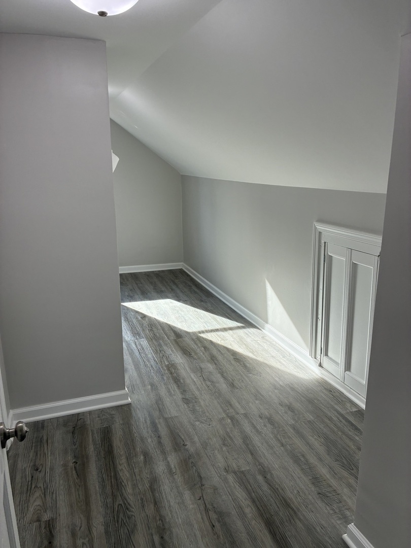 621 Mohawk Street Joliet, IL 60432 - Photo 12 of 15 a view of empty room with wooden floor