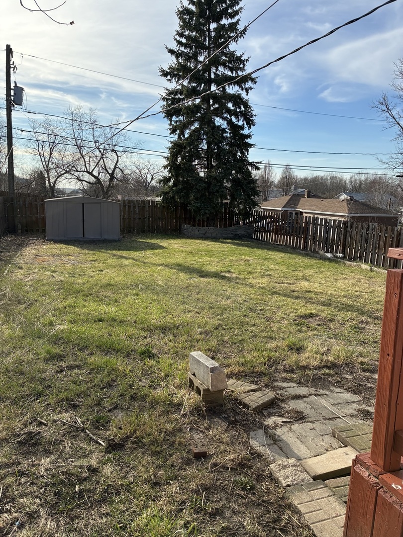 621 Mohawk Street Joliet, IL 60432 - Photo 5 of 15 a view of a lake with a yard