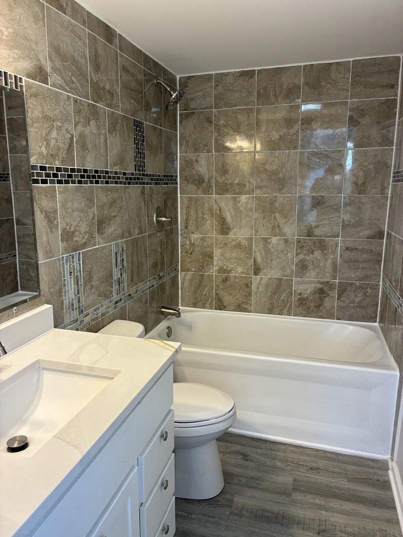621 Mohawk Street Joliet, IL 60432 - Photo 10 of 15 a bathroom with a sink and a toilet
