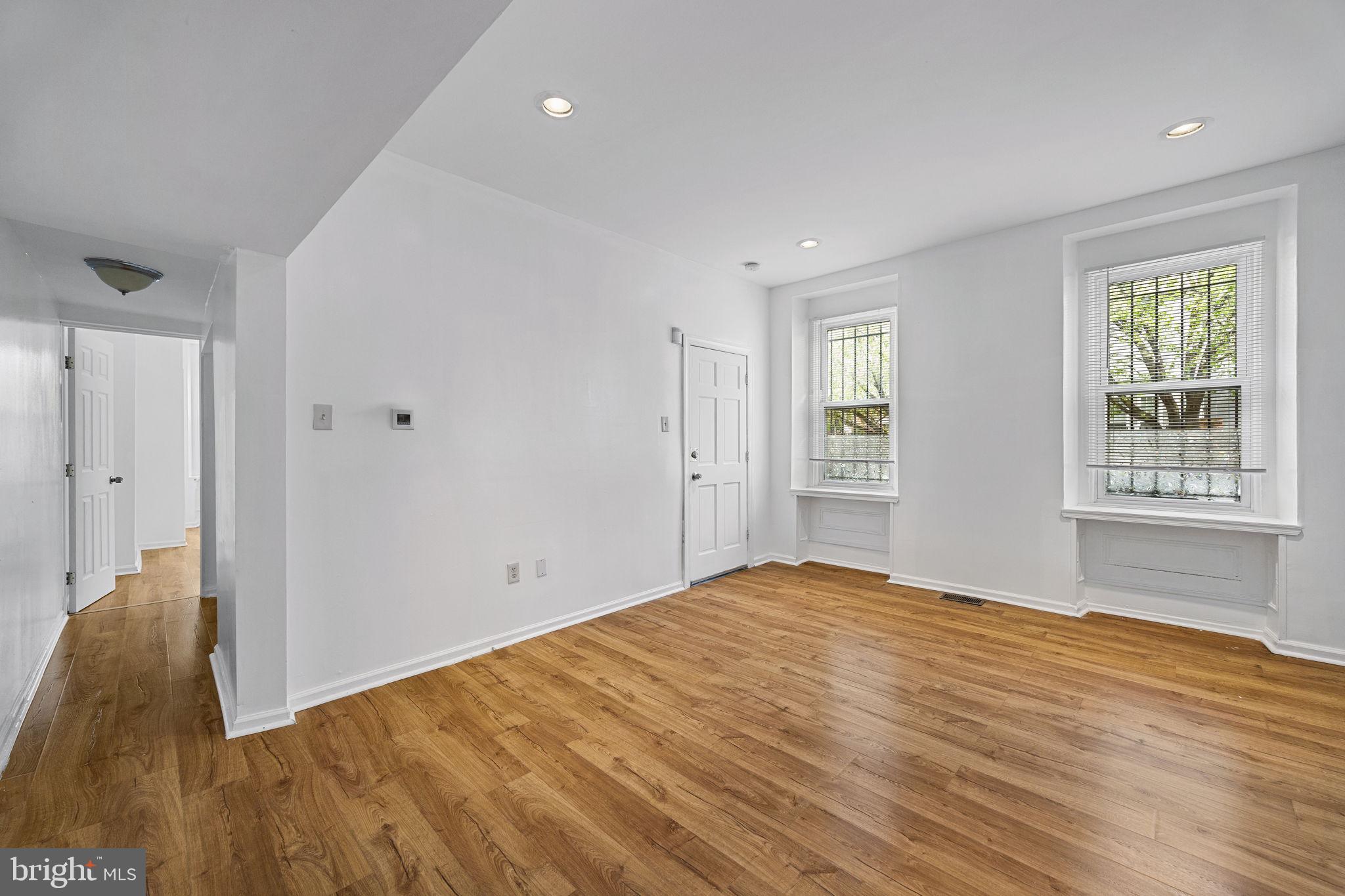 3800 Spring Garden Street Philadelphia, PA 19104 - Photo 20 of 35 a view of an empty room with wooden floor and a window