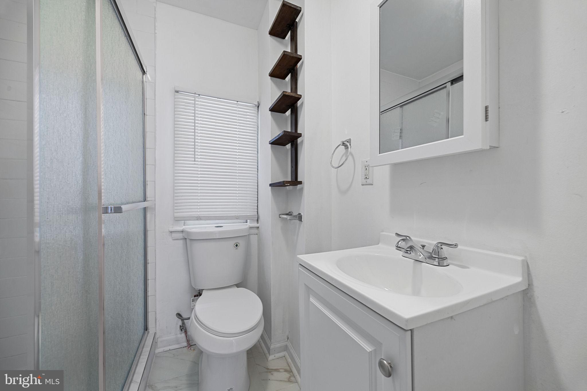 3800 Spring Garden Street Philadelphia, PA 19104 - Photo 23 of 35 a bathroom with a sink toilet and vanity