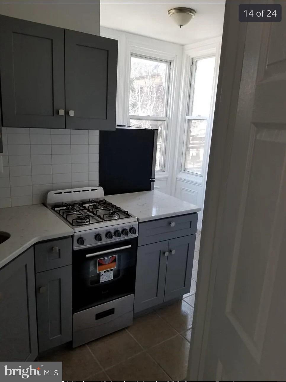 3800 Spring Garden Street Philadelphia, PA 19104 - Photo 28 of 35 a kitchen with a stove and a microwave