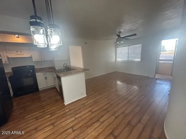 a view of livingroom with furniture and wooden floor
