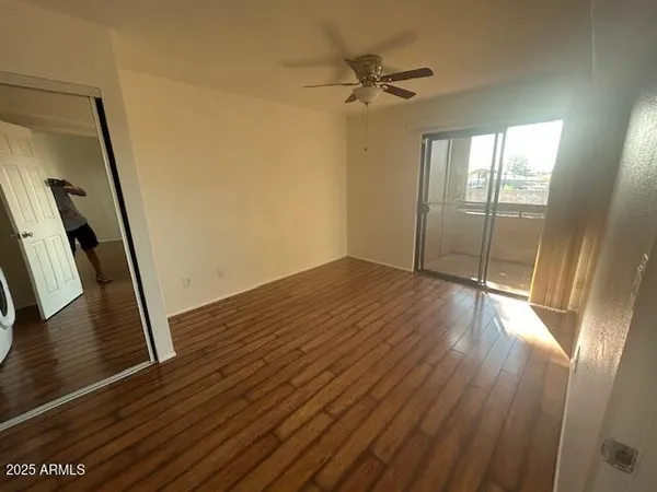 a view of hallway with wooden floor