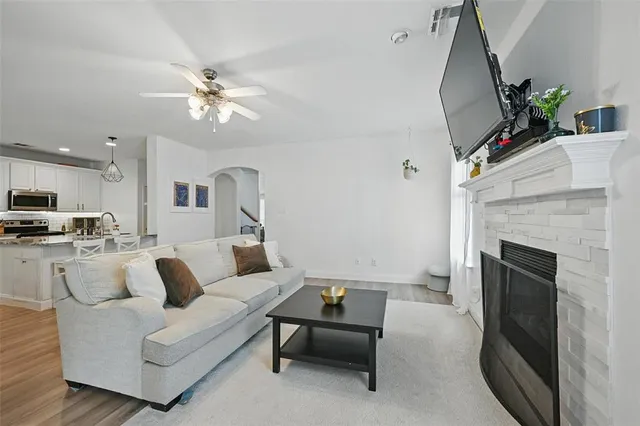 a living room with furniture and a fireplace