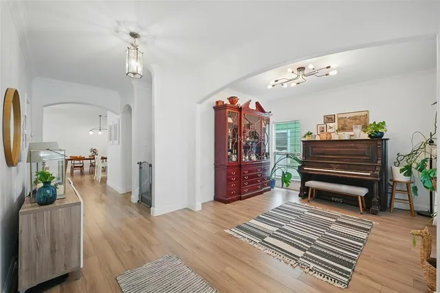a bedroom with furniture and wooden floor
