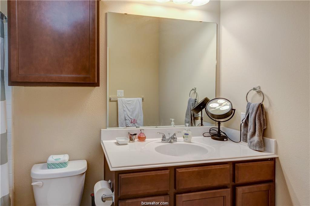 1198 Jones-Butler Road, Unit 406 College Station, TX 77840 - Photo 11 of 12 a bathroom with a sink and a toilet