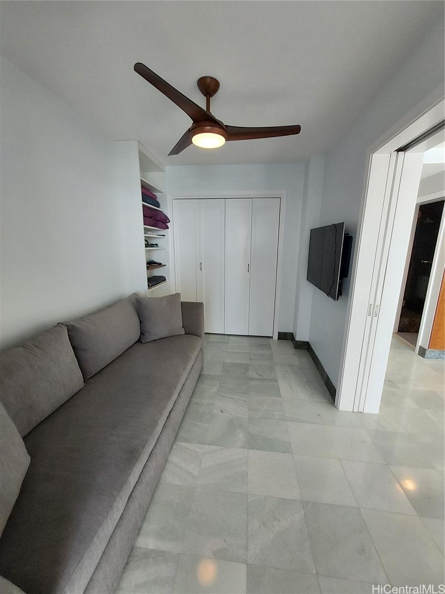 2801 Coconut Avenue, Unit 6B Honolulu, HI 96815 - Photo 6 of 12 a view of a livingroom with furniture and a ceiling fan