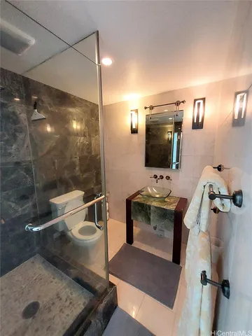 a bathroom with a sink and mirror