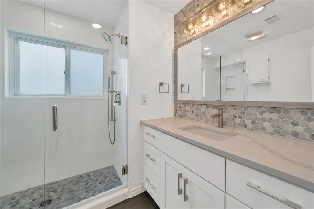 2909 Normandy Court Euless, TX 76039 - Photo 29 of 36 a bathroom with a sink and a mirror