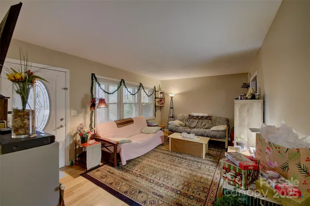a living room with lots of furniture and a wooden floor