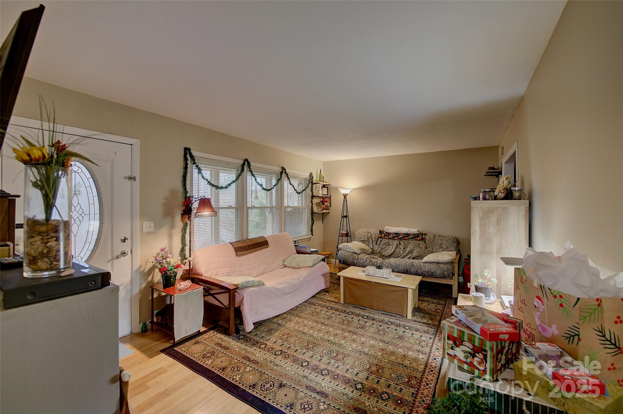 583 Deer Park Lake Road Spruce Pine, NC 28777 - Photo 13 of 24 a living room with lots of furniture and a wooden floor