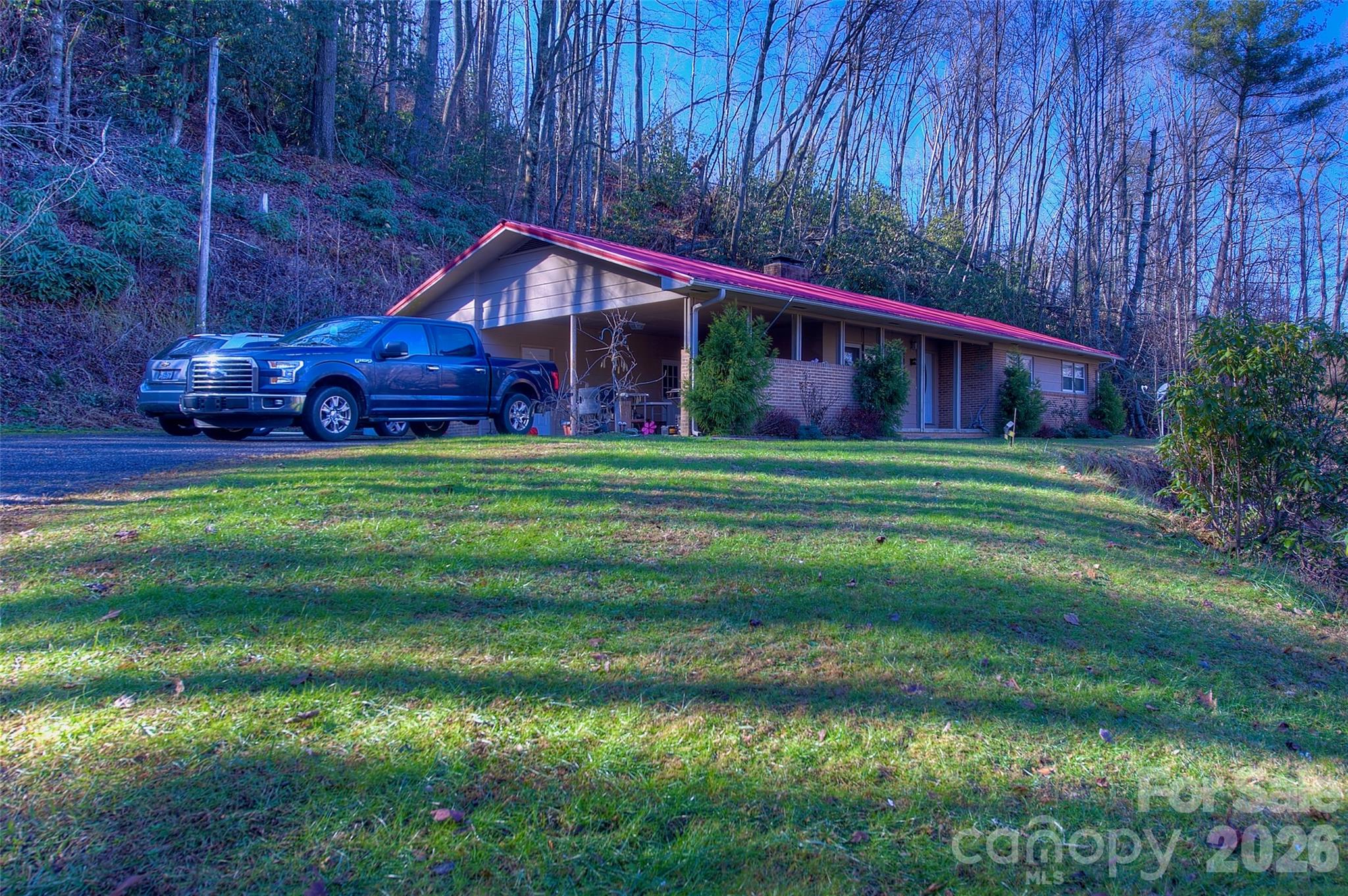 583 Deer Park Lake Road Spruce Pine, NC 28777 - Photo 18 of 24 a house view with a garden space