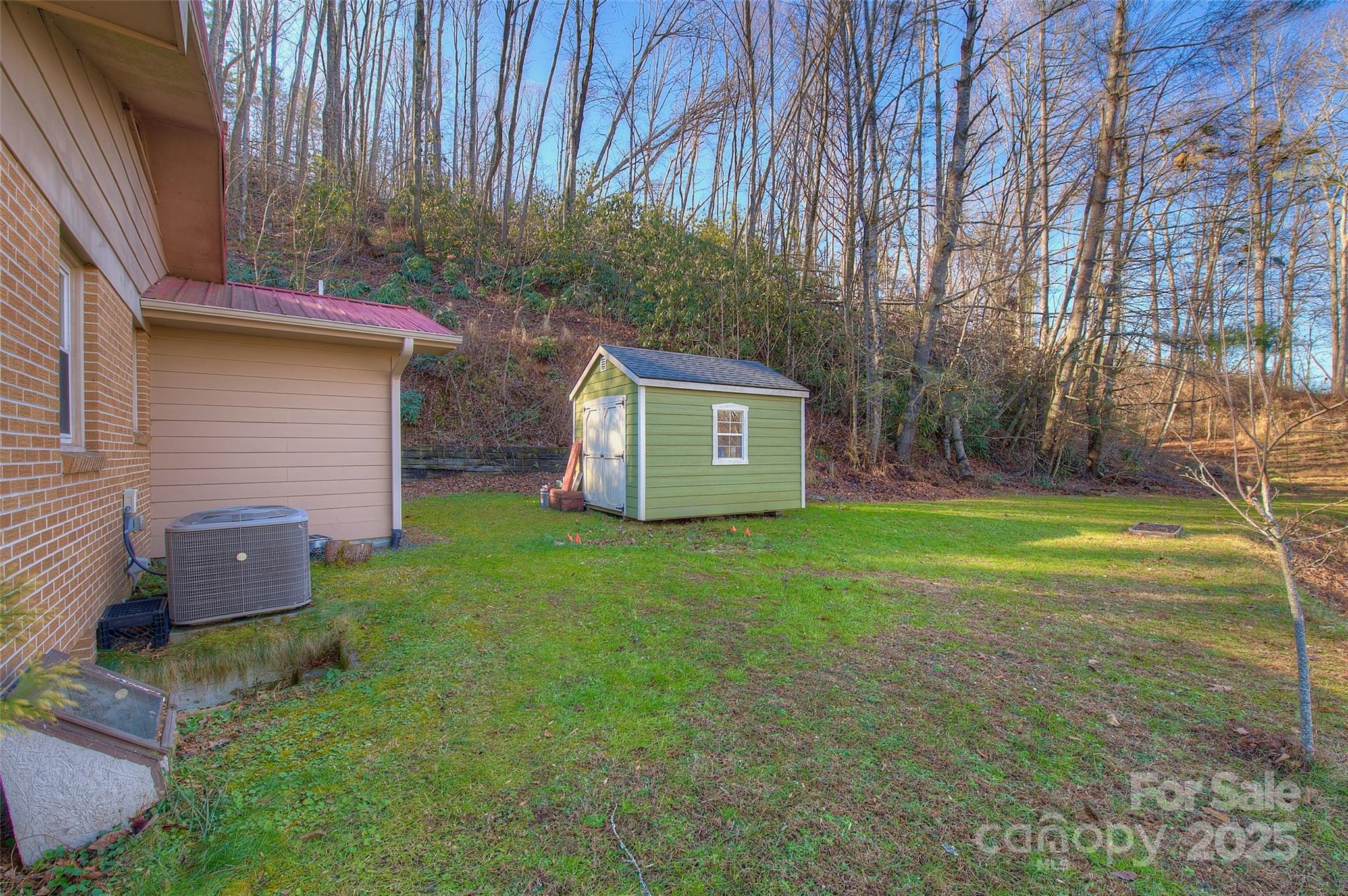 583 Deer Park Lake Road Spruce Pine, NC 28777 - Photo 23 of 24 a view of a backyard with a garden