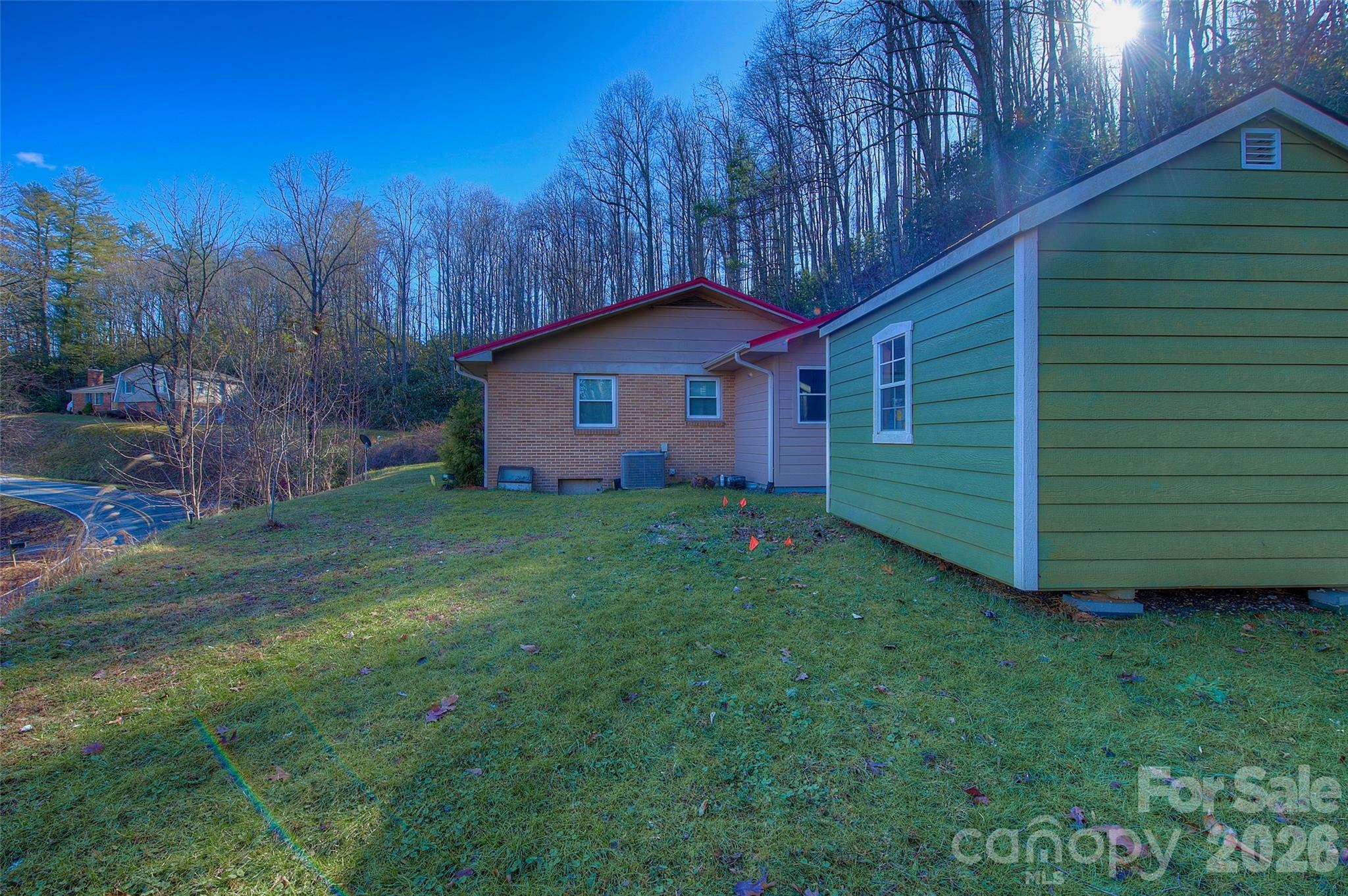 583 Deer Park Lake Road Spruce Pine, NC 28777 - Photo 24 of 24 a front view of a house with a garden