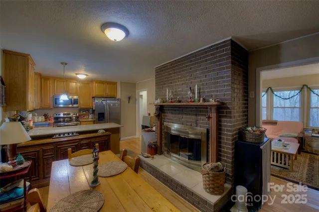 a kitchen with sink refrigerator and stove