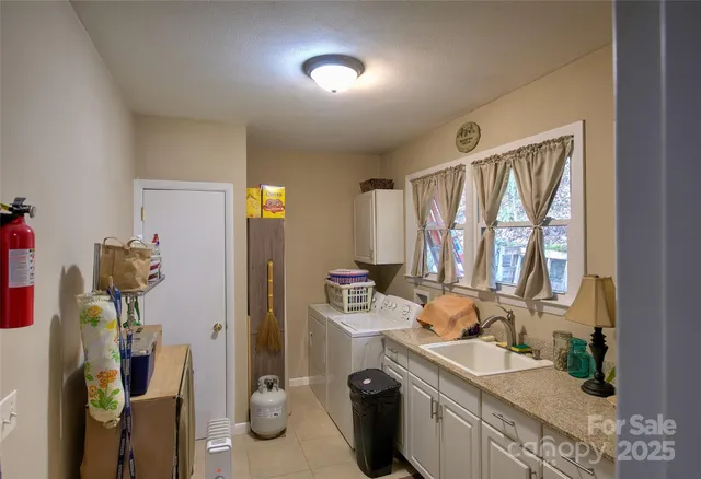 a bathroom with a sink double vanity and a mirror