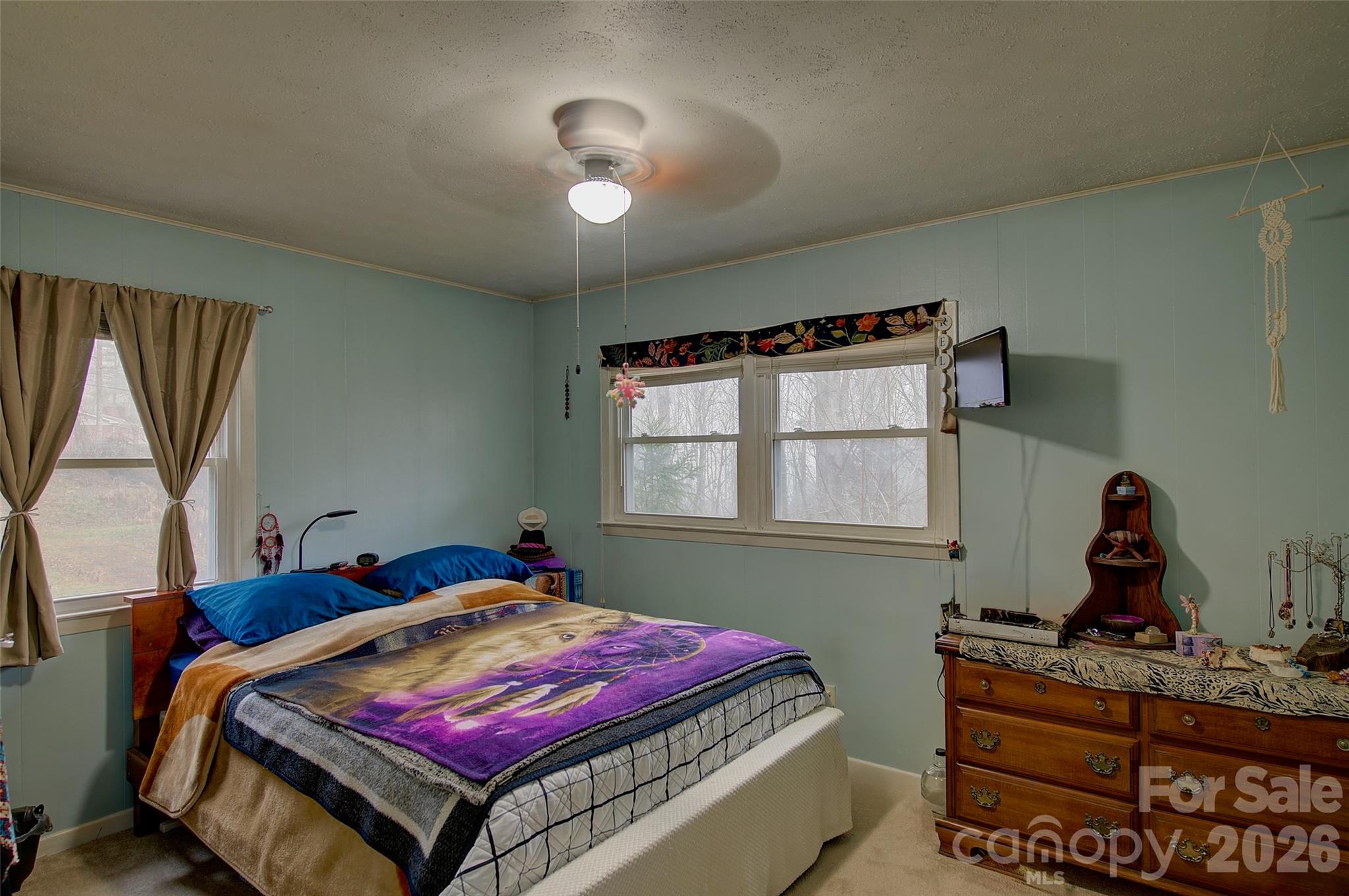 583 Deer Park Lake Road Spruce Pine, NC 28777 - Photo 9 of 24 a bedroom with a bed and window