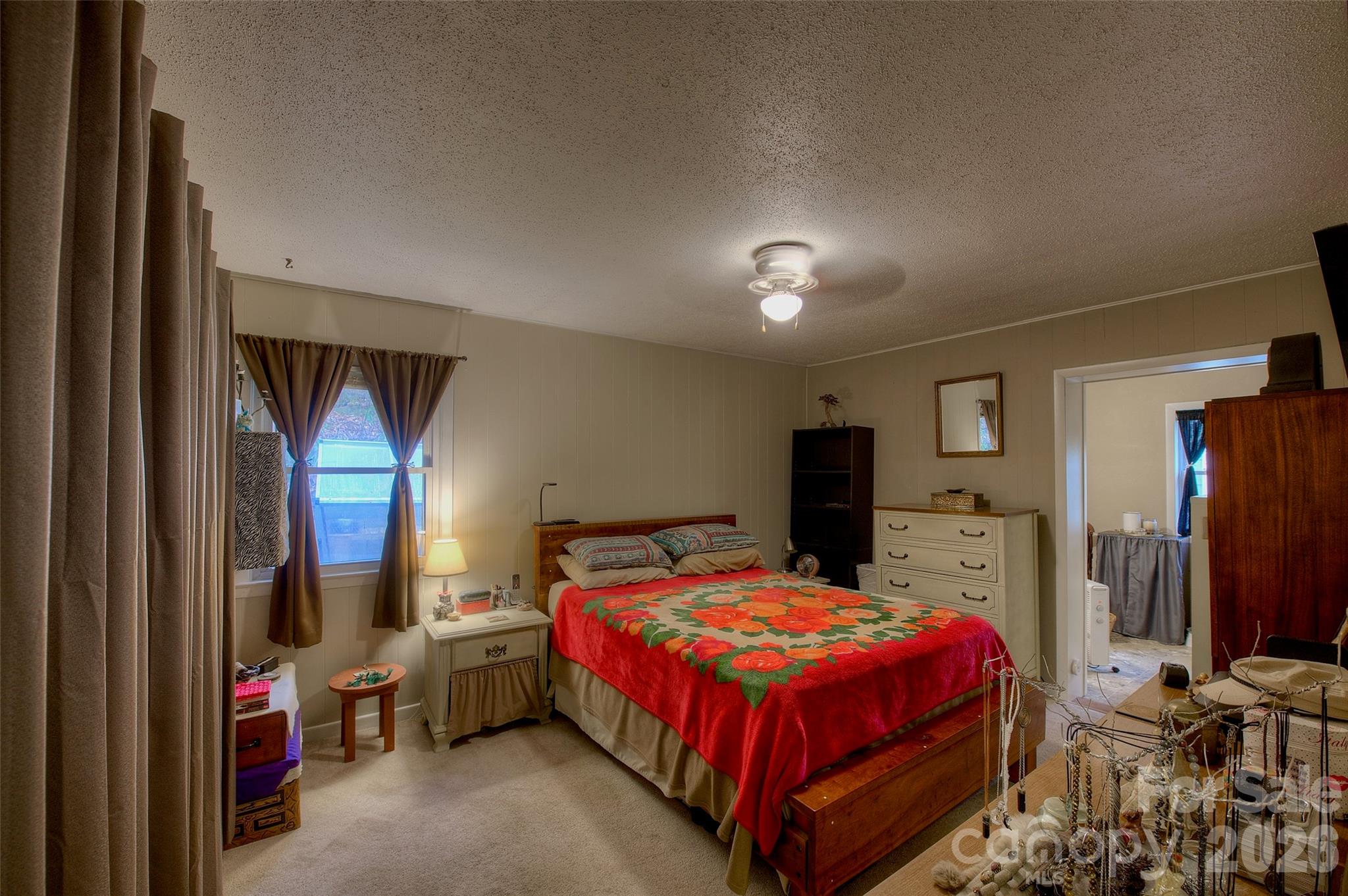 583 Deer Park Lake Road Spruce Pine, NC 28777 - Photo 10 of 24 a bedroom with a bed closet and a window