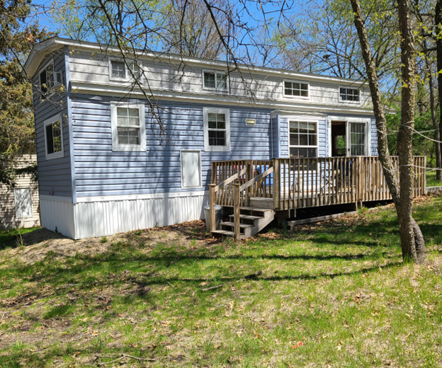21-80 Woodhaven Sublette, IL 61367 - Photo 1 of 21 front view of a house with a yard