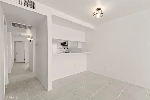 a view of a hallway with closet area