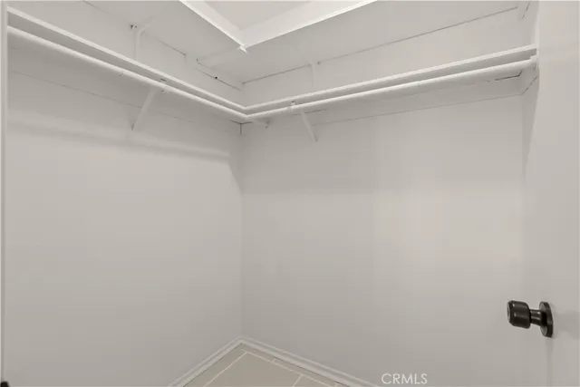 a kitchen with cabinets and window