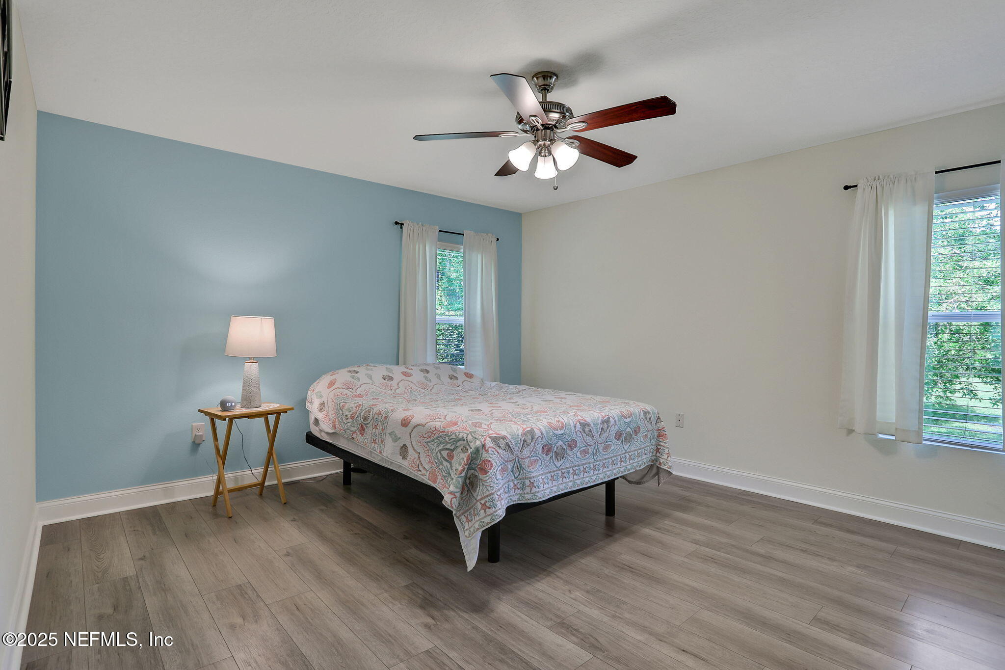 35 Root Lane St. Augustine, FL 32084 - Photo 23 of 37 a bedroom with a bed table and window