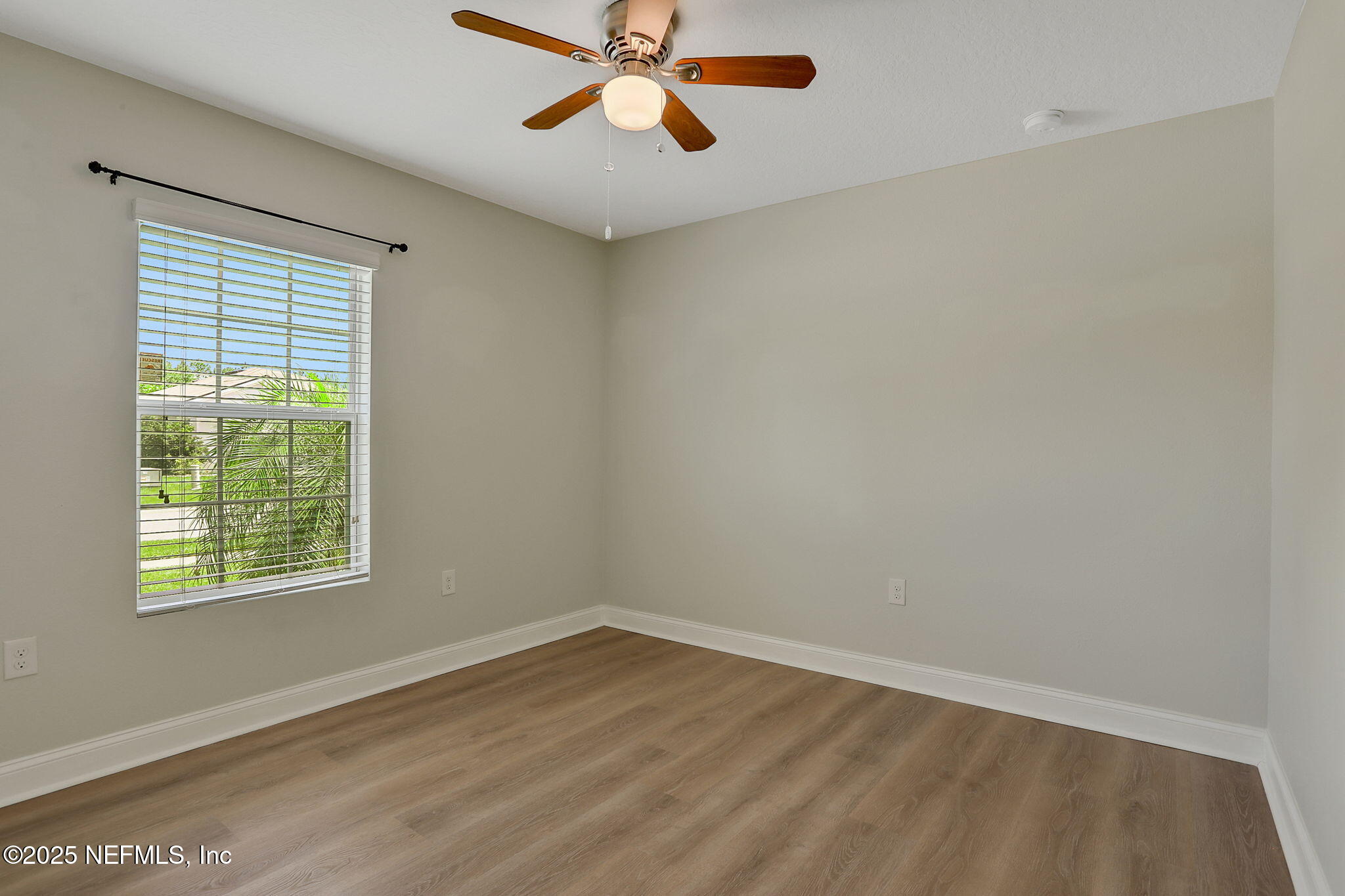 35 Root Lane St. Augustine, FL 32084 - Photo 30 of 37 wooden floor in an empty room with a window