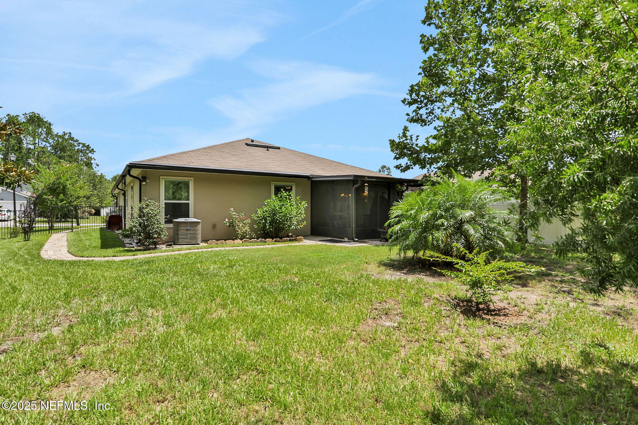 35 Root Lane St. Augustine, FL 32084 - Photo 36 of 37 a front view of a house with a yard