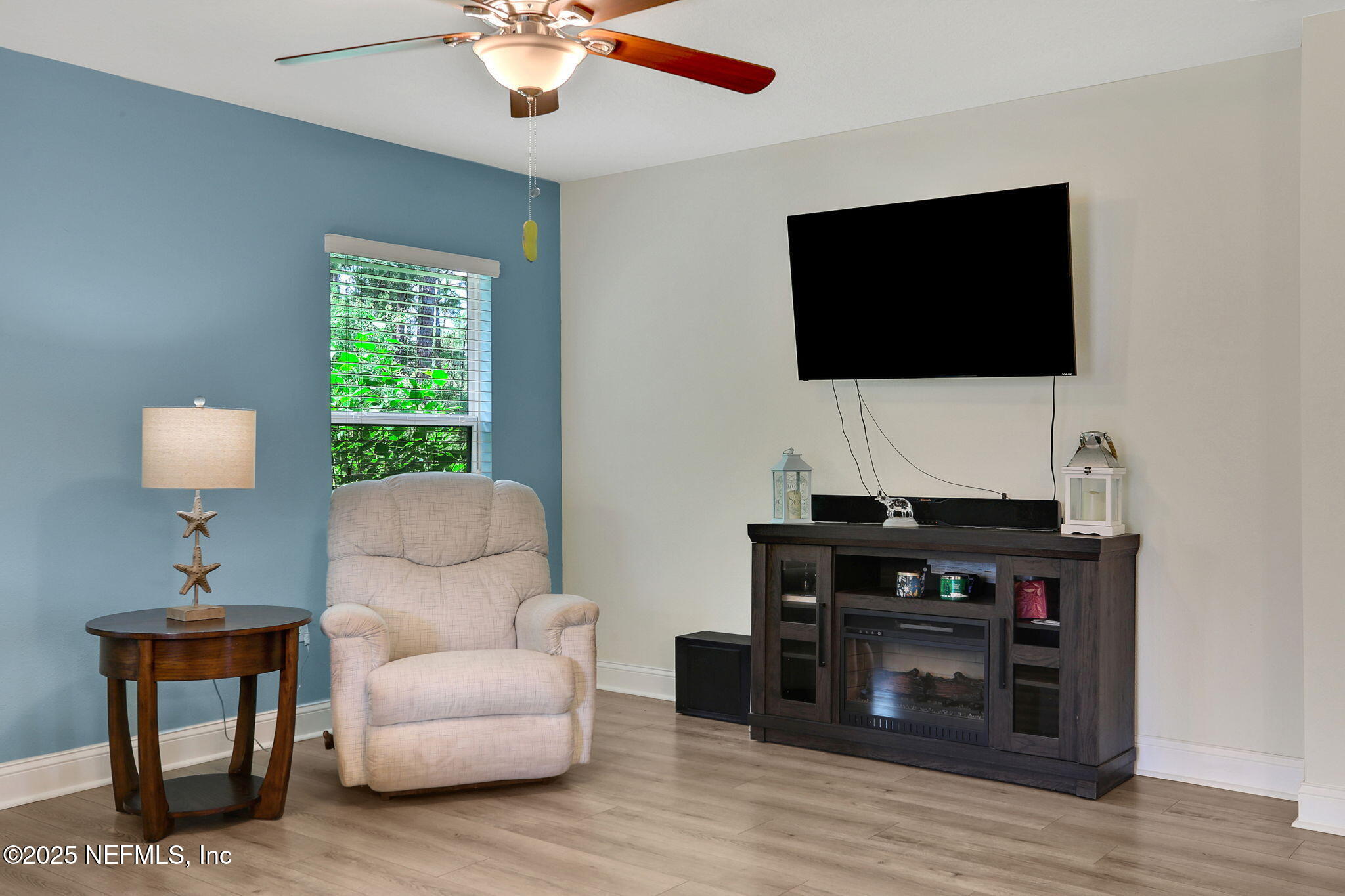 35 Root Lane St. Augustine, FL 32084 - Photo 9 of 37 a living room with furniture and a flat screen tv