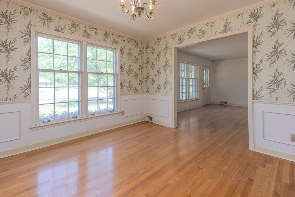 2448 Elmore Park Road Bartlett, TN 38134 - Photo 11 of 28 an empty room with wooden floor and windows
