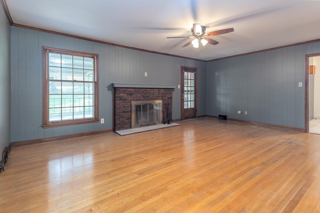 2448 Elmore Park Road Bartlett, TN 38134 - Photo 14 of 28 an empty room with windows and a fireplace