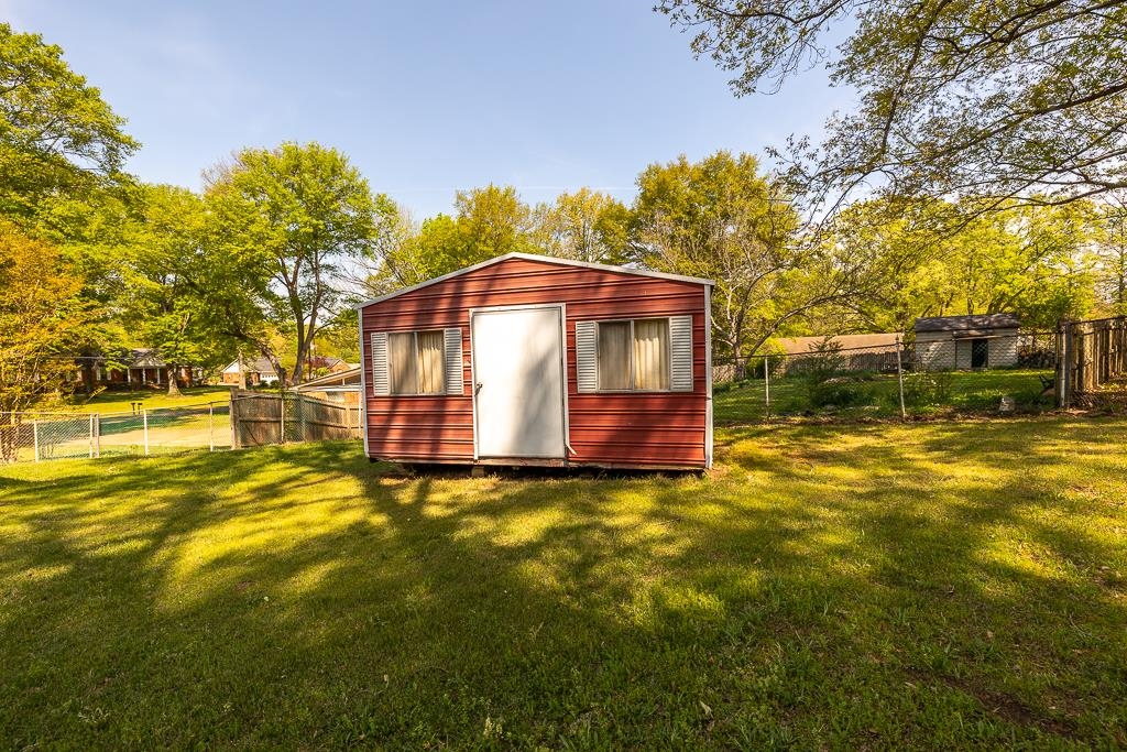 2448 Elmore Park Road Bartlett, TN 38134 - Photo 26 of 28 a front view of a house with swimming pool