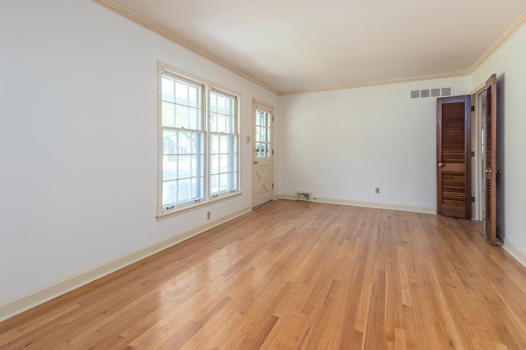 2448 Elmore Park Road Bartlett, TN 38134 - Photo 4 of 28 a view of empty room with wooden floor and fan