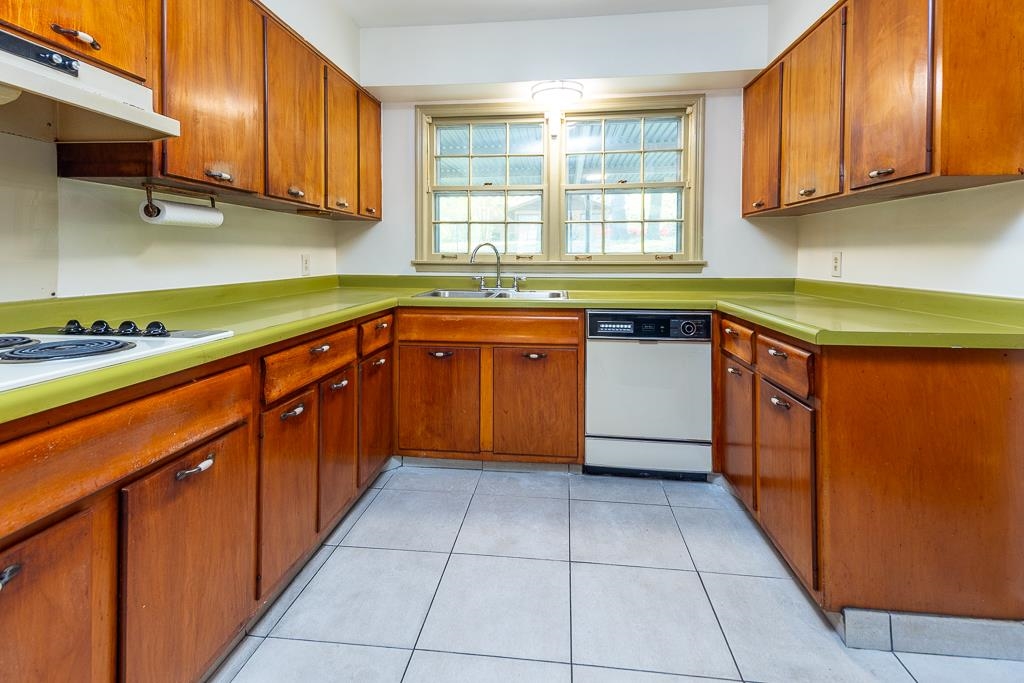 2448 Elmore Park Road Bartlett, TN 38134 - Photo 6 of 28 a kitchen with stainless steel appliances granite countertop a sink counter space cabinets and a large window
