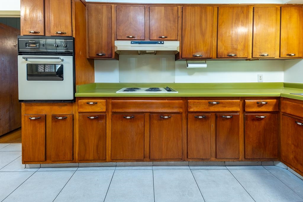 2448 Elmore Park Road Bartlett, TN 38134 - Photo 7 of 28 a kitchen with stainless steel appliances granite countertop a cabinets and a view of living room