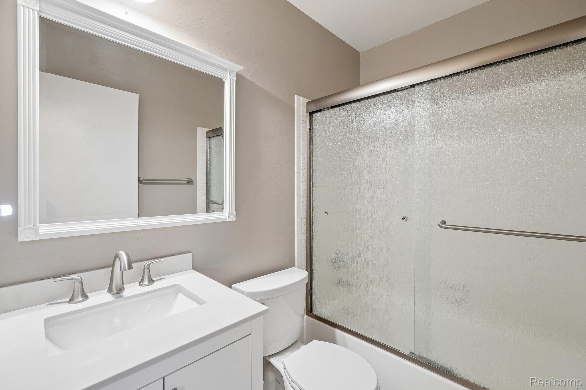 44 Stratford Lane Rochester, MI 48309 - Photo 20 of 37 Bathroom featuring combined bath / shower with glass door and vanity