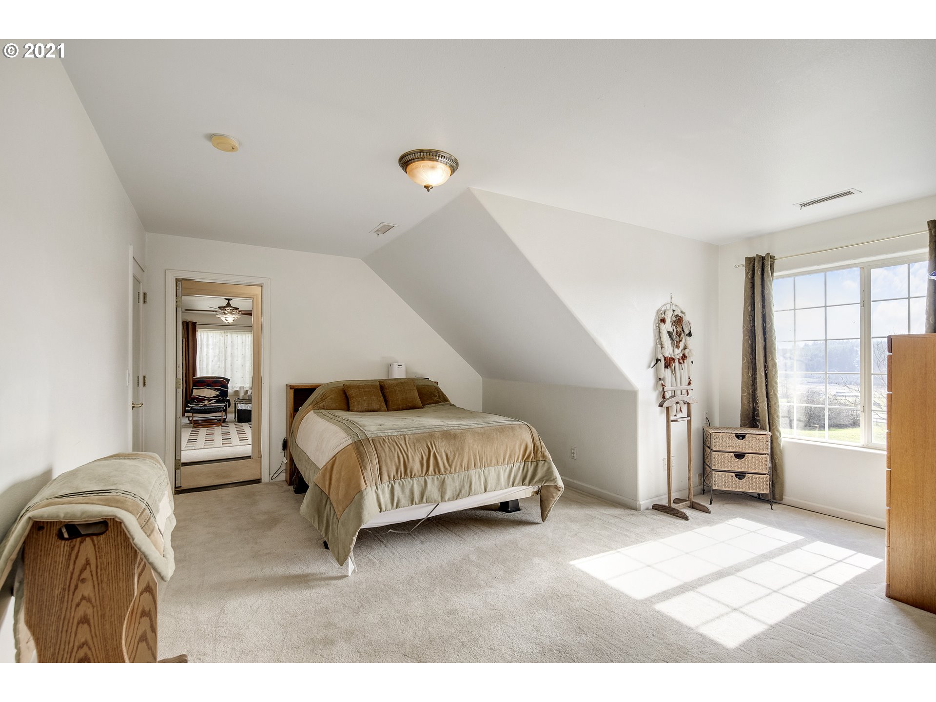 46400 Southwest Hebo Road Grand Ronde, OR 97347 - Photo 14 of 26 a bedroom with a bed next to a window