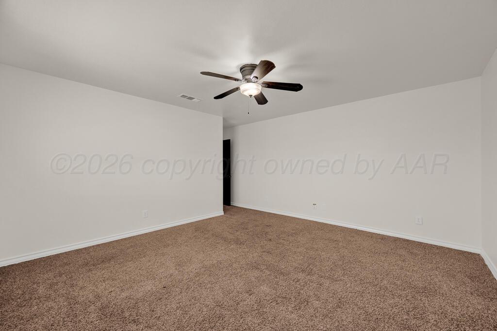 8027 Simpson Drive Amarillo, TX 79121 - Photo 16 of 32 a view of a big room with carpet
