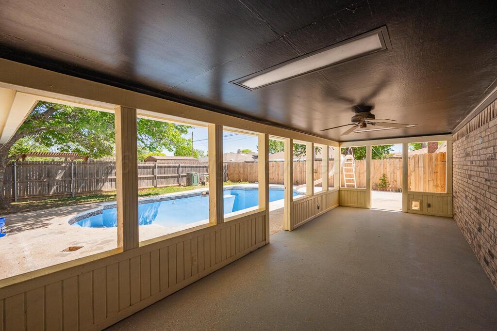 8027 Simpson Drive Amarillo, TX 79121 - Photo 29 of 32 a view of an empty room with windows