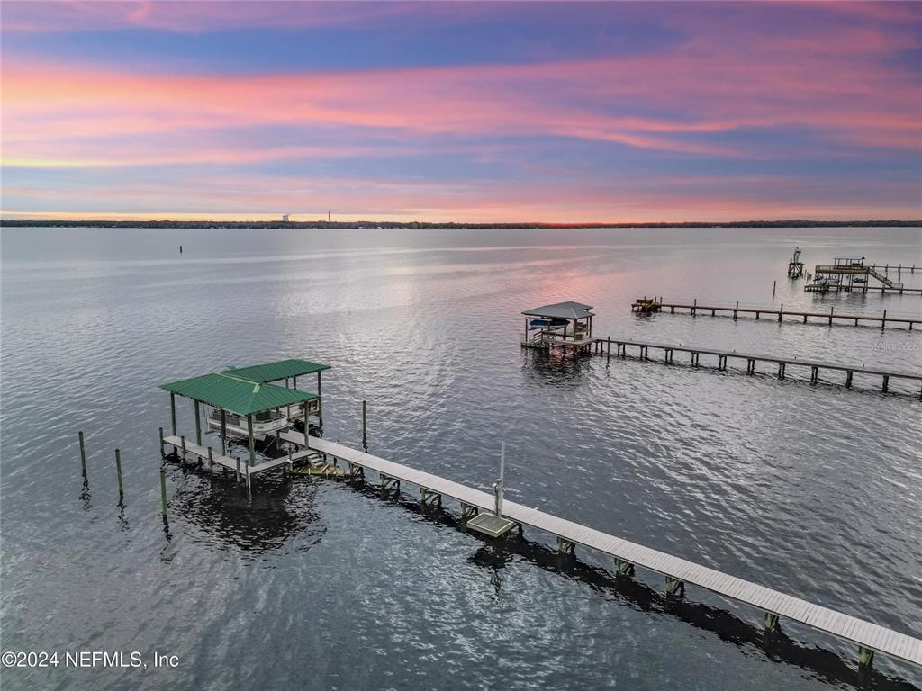 a view of a lake with outdoor seating