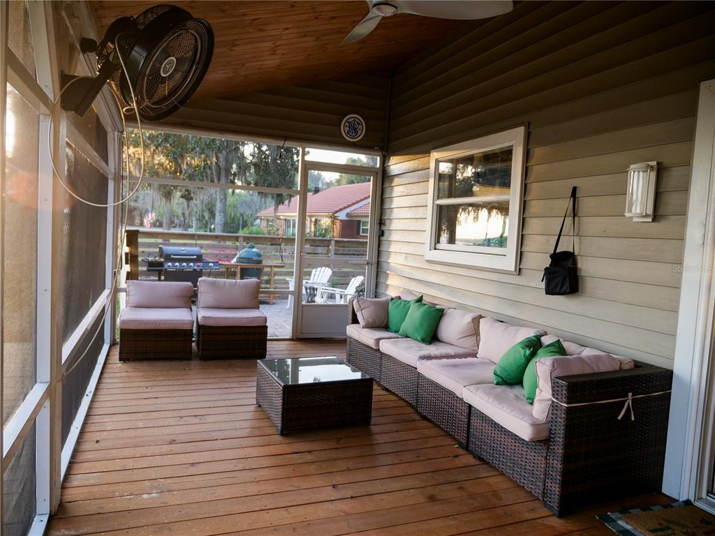 1711 County Road 13 South Elkton, FL 32033 - Photo 30 of 78 a balcony with furniture and a large window