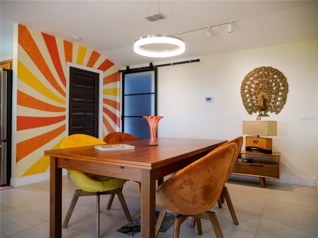 1711 County Road 13 South Elkton, FL 32033 - Photo 31 of 78 a dining room with furniture and wooden floor