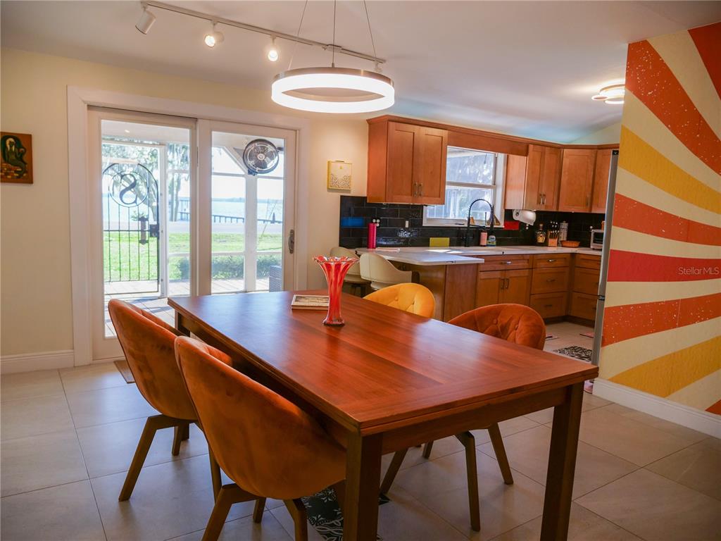1711 County Road 13 South Elkton, FL 32033 - Photo 33 of 78 a view of a dining room with furniture and a potted plant