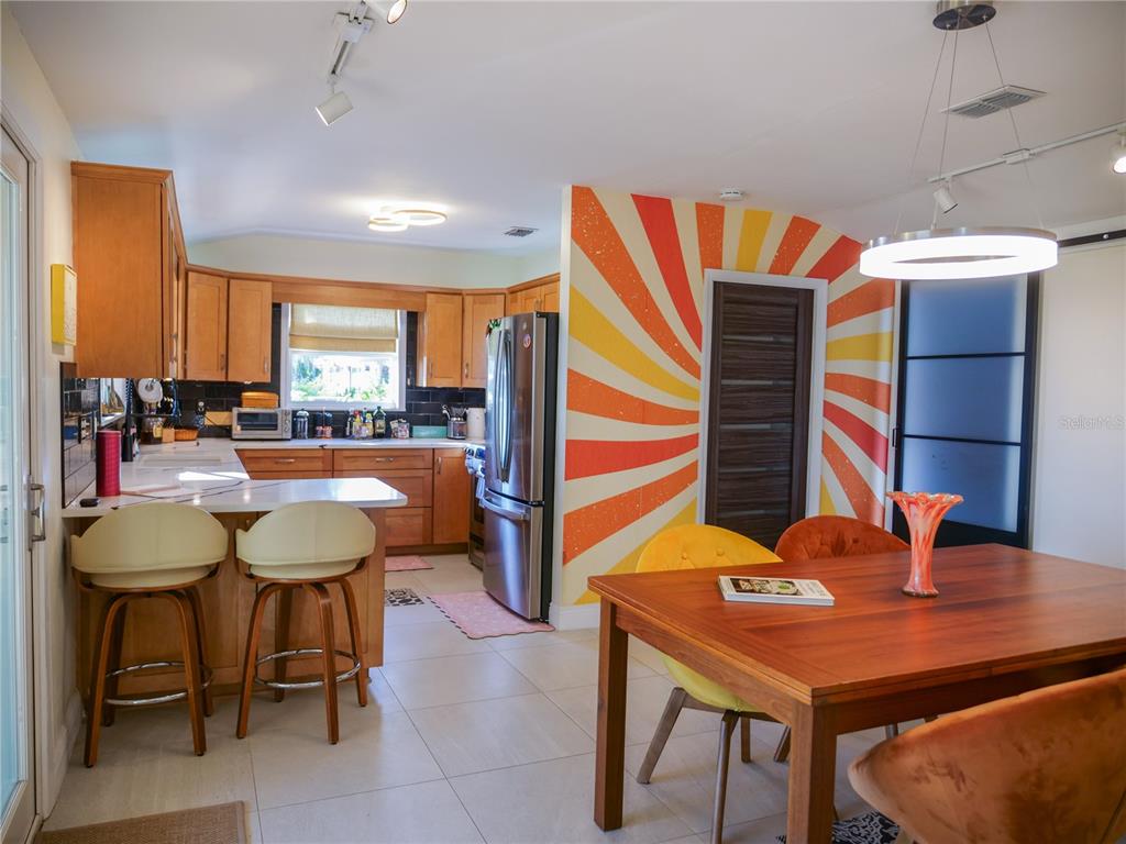 1711 County Road 13 South Elkton, FL 32033 - Photo 34 of 78 a dining room with furniture and wooden floor