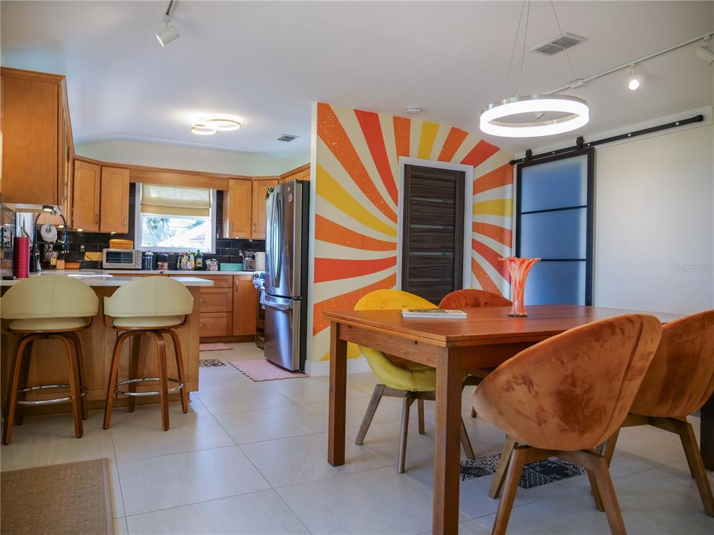 1711 County Road 13 South Elkton, FL 32033 - Photo 35 of 78 a view of a dining room with furniture and chandelier