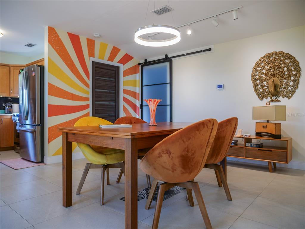 1711 County Road 13 South Elkton, FL 32033 - Photo 36 of 78 a view of a dining room with furniture and wooden floor