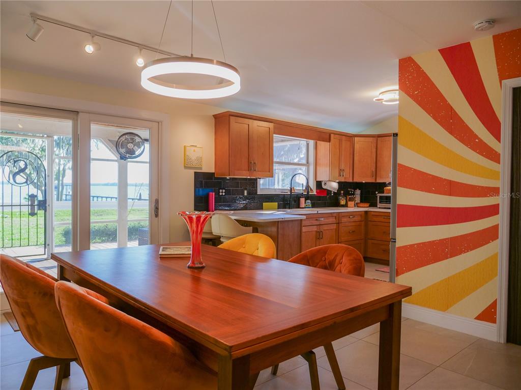 1711 County Road 13 South Elkton, FL 32033 - Photo 40 of 78 a dining room with a large window and table