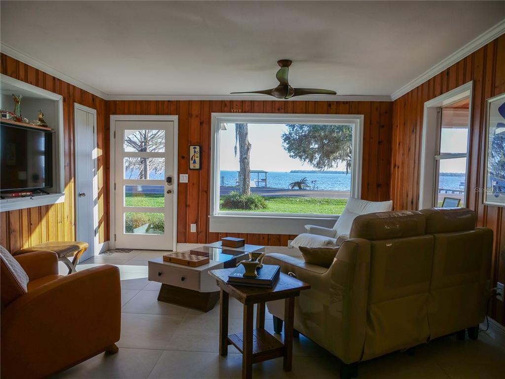 1711 County Road 13 South Elkton, FL 32033 - Photo 43 of 78 a living room with furniture and a flat screen tv
