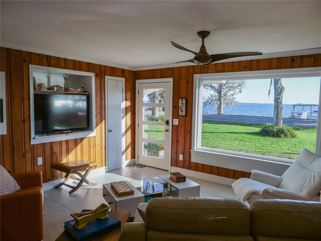 1711 County Road 13 South Elkton, FL 32033 - Photo 47 of 78 a living room with furniture and a flat screen tv